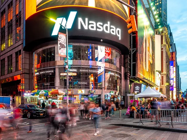 The Nasdaq MarketSite tower in Times Square, New York, lit up with the Nasdaq logo in the evening