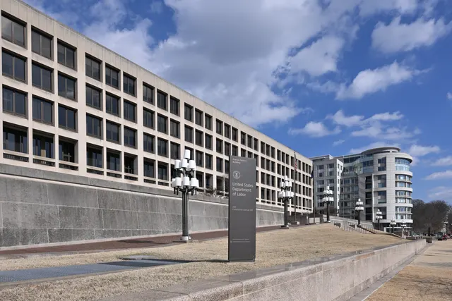The United States Department of Labor sign in front of the Frances Perkins Building on Constitution Avenue in Washington, D.C.