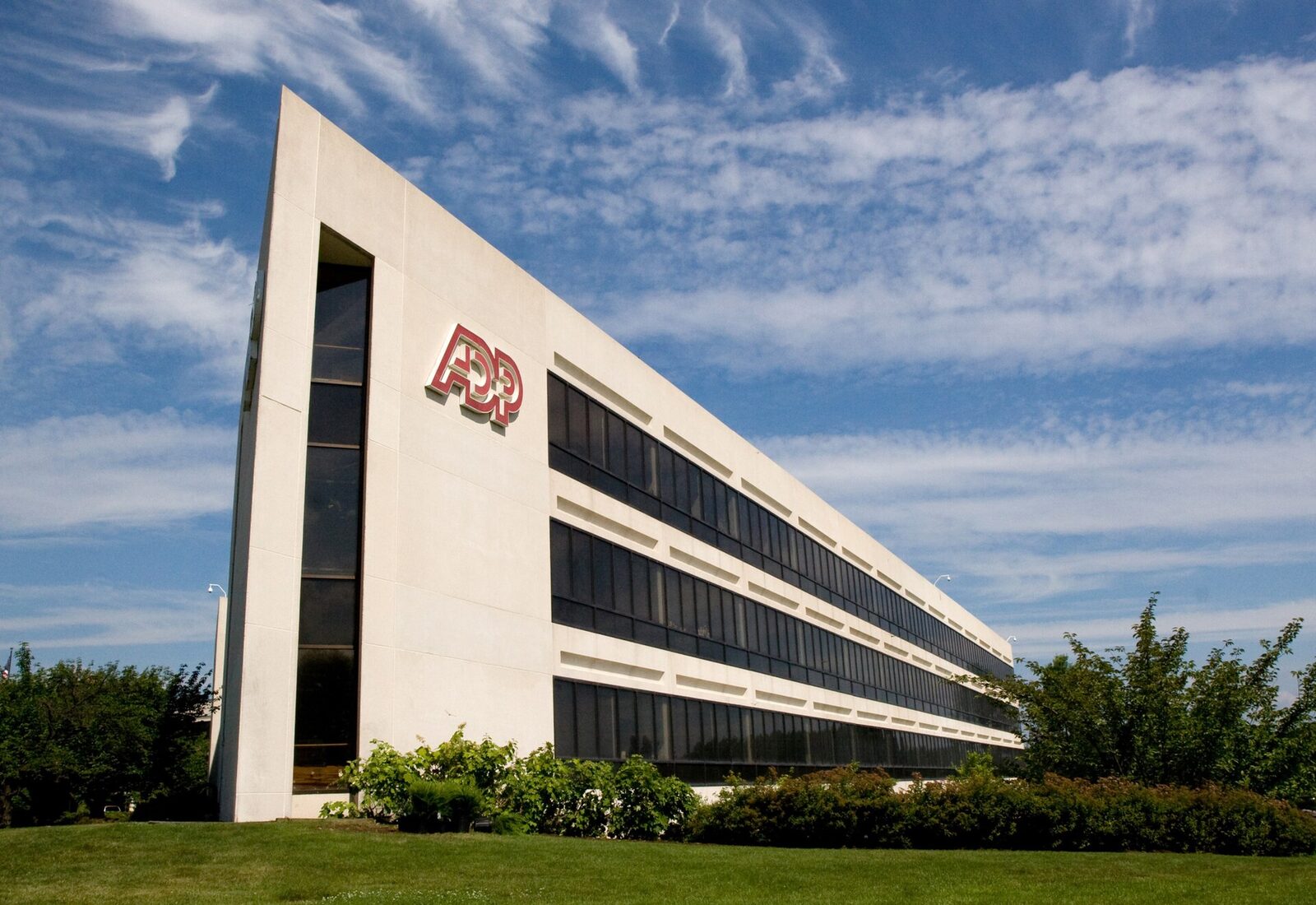 ADP headquarters building with the red ADP logo on the front