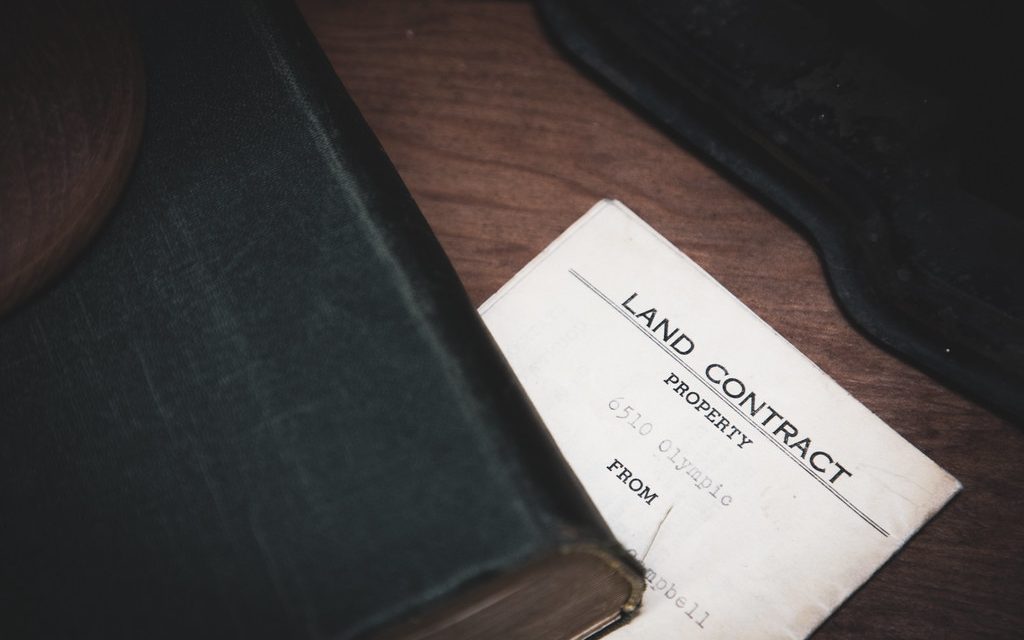 A property contract document on a desk