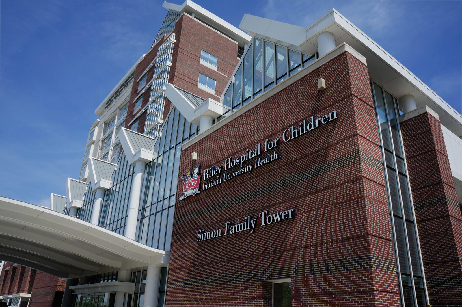The exterior of Riley Hospital for Children at Indiana University Health, with the hospital name on the wall