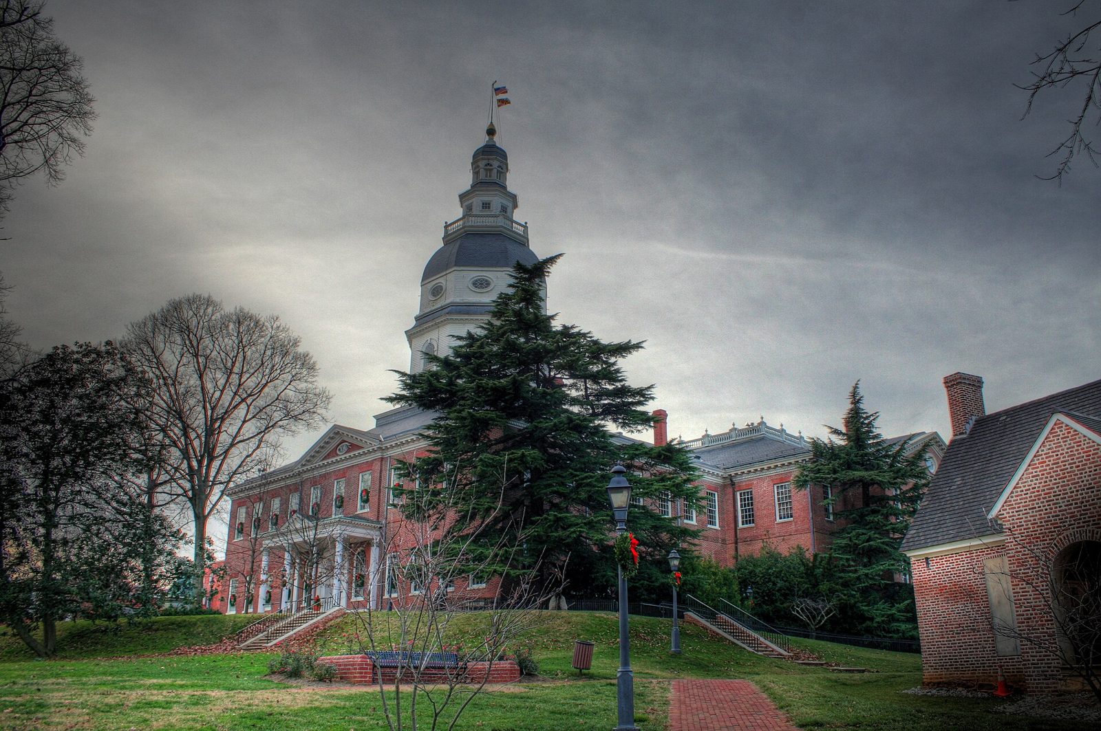 The Maryland State House dome rises above trees in Annapolis.
