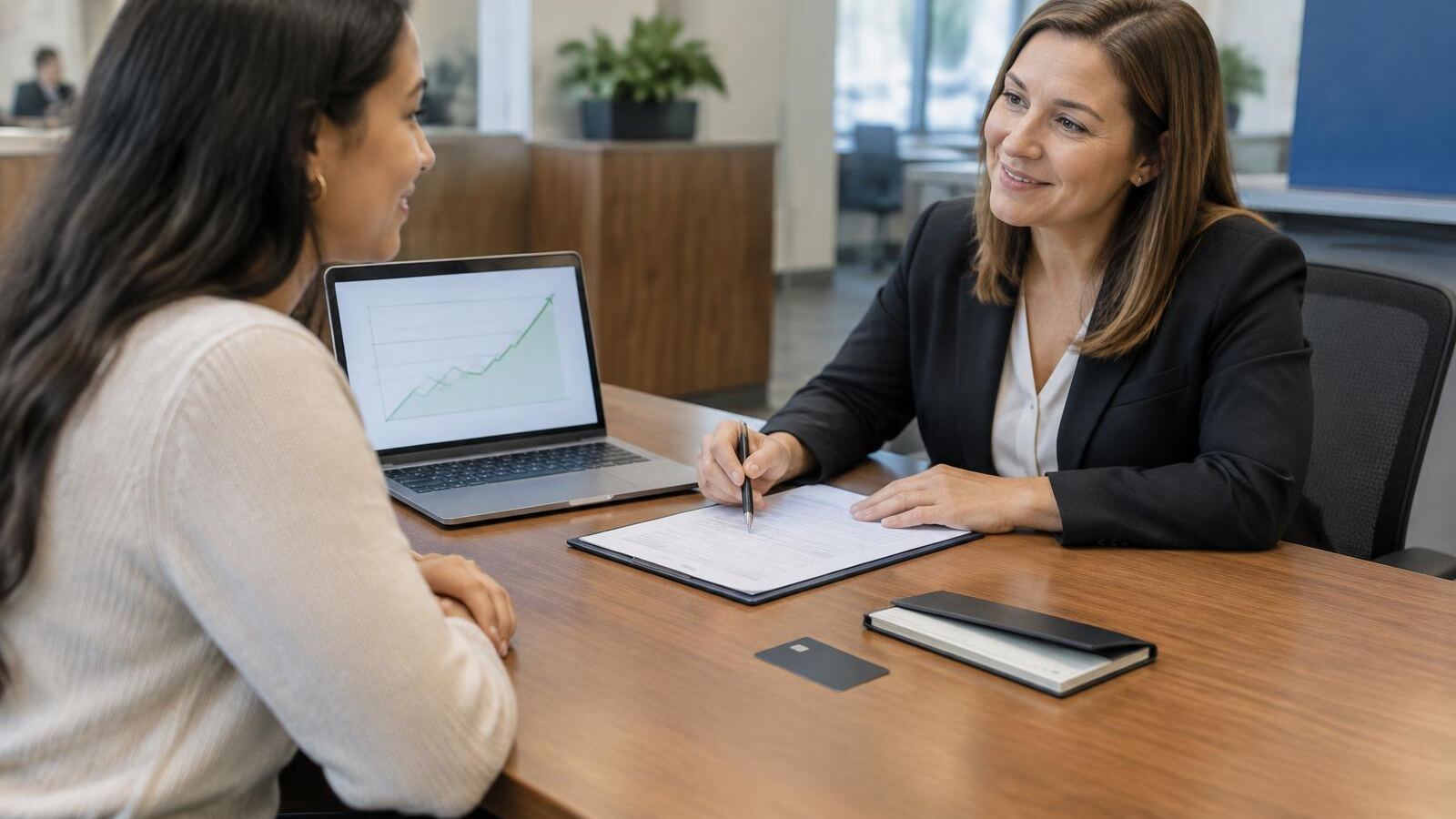 Woman opening a money market account with a banker
