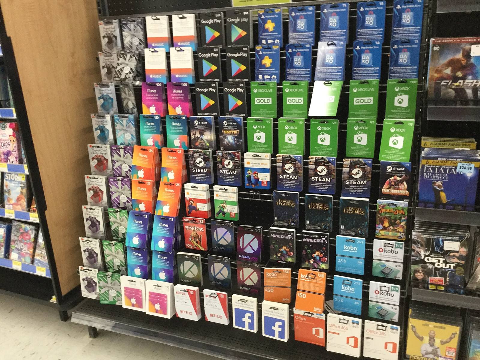 A store rack packed with gift cards from many brands.