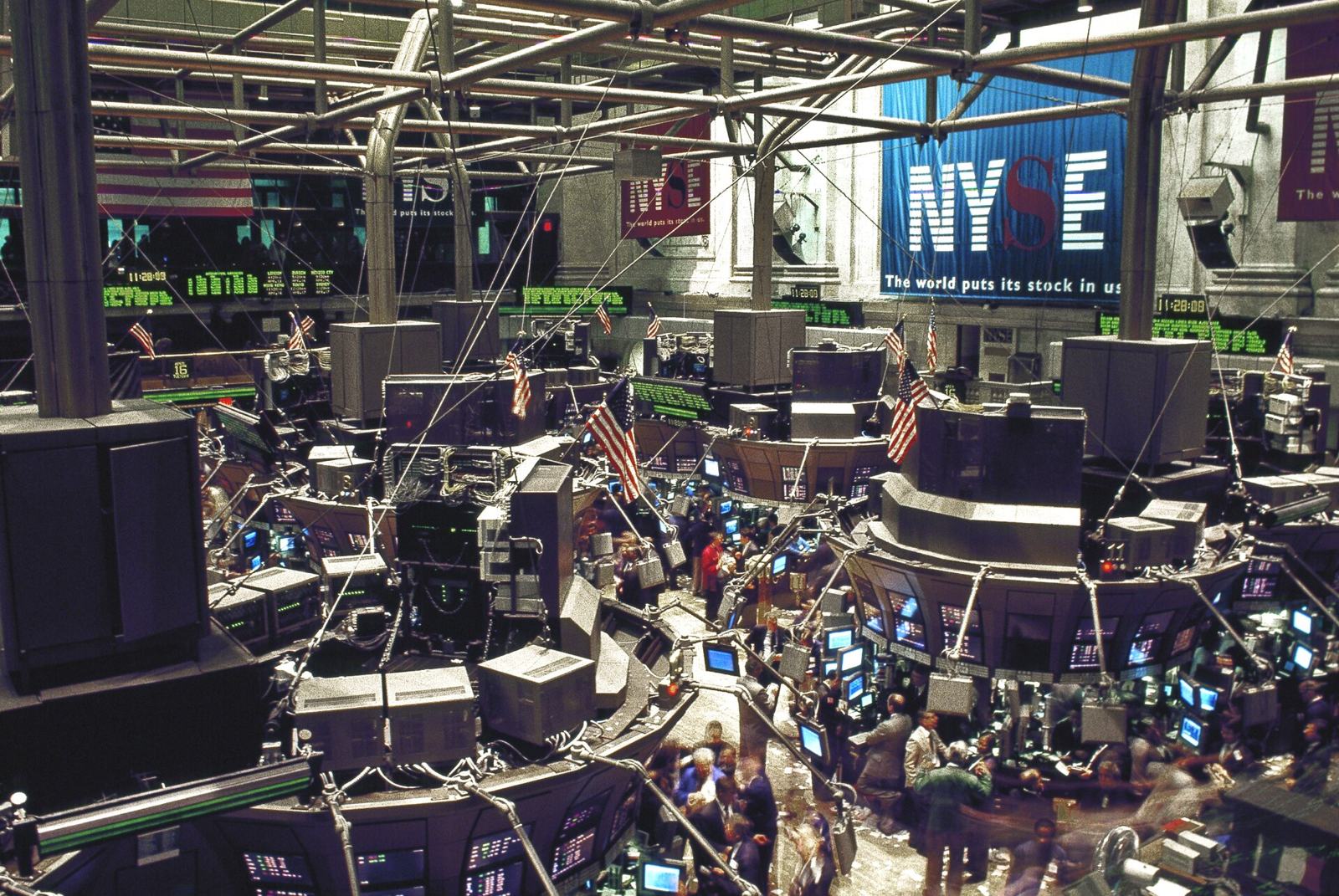 Traders and screens crowd the New York Stock Exchange trading floor.