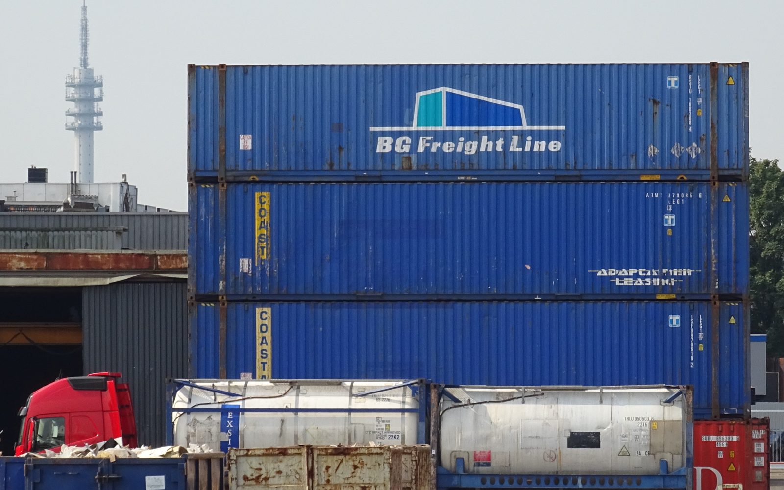 Stacked shipping containers at a cargo port