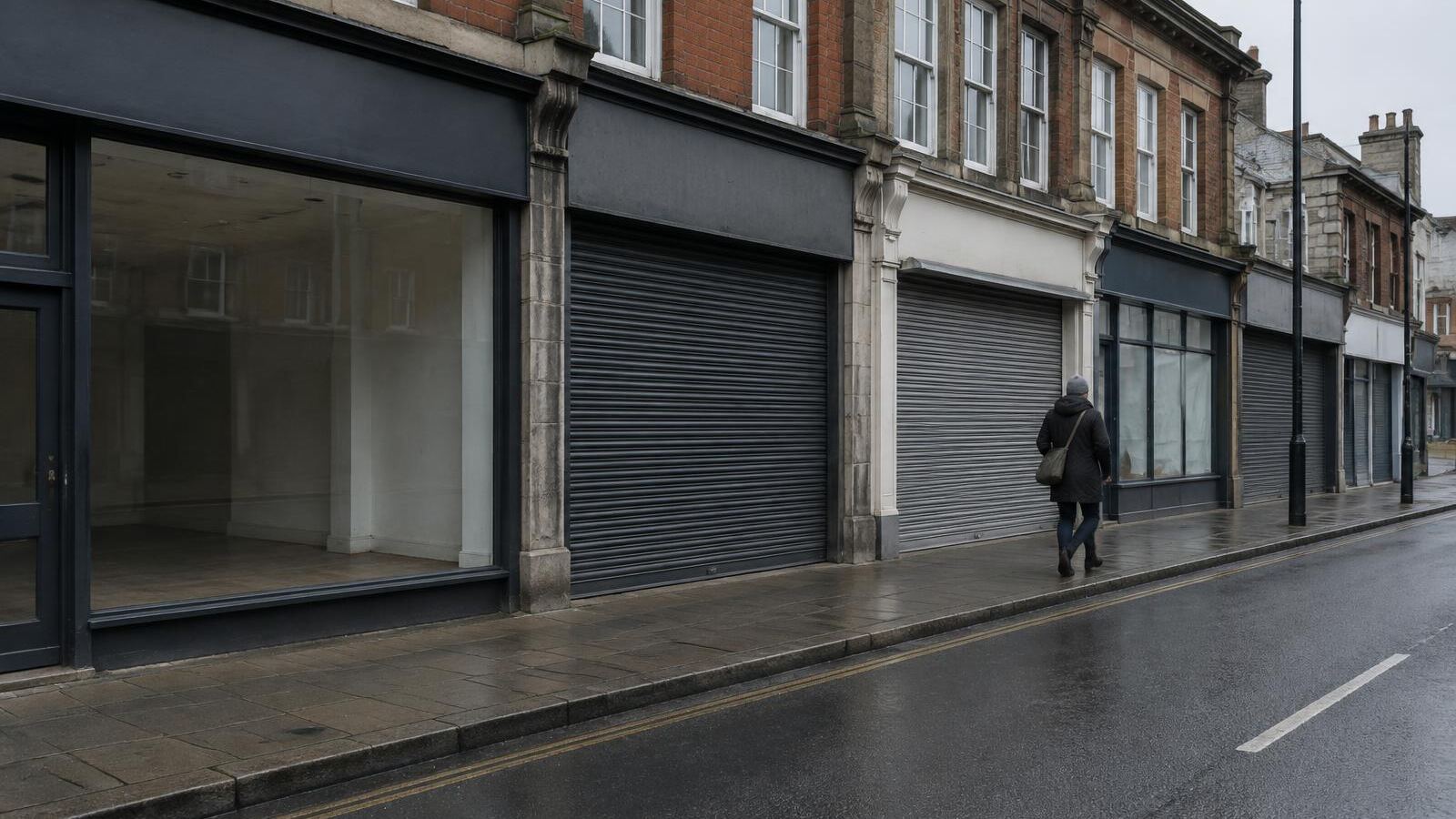 Main street lined with shuttered and empty storefronts