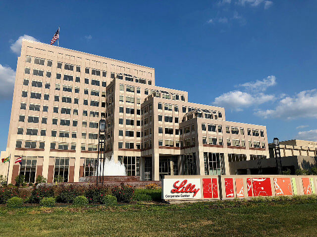 Eli Lilly's corporate center in Indianapolis with the red Lilly logo on a sign out front