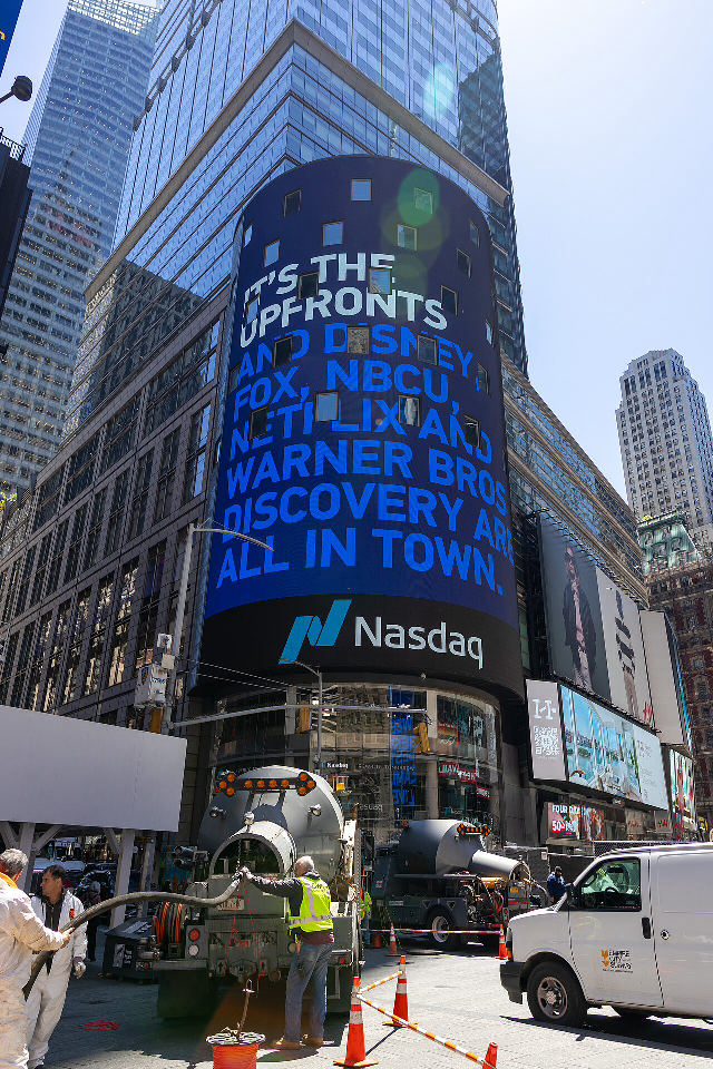 The Nasdaq MarketSite tower in Times Square, New York, with the Nasdaq logo on its curved video screen