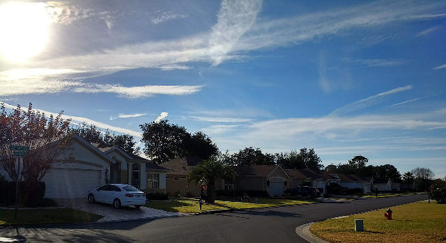 A quiet street of single-story homes in a Del Webb retirement community in Summerfield, Florida