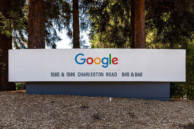 The Google logo on a white sign for buildings B45 and B46 at 1565 and 1585 Charleston Road, part of Google's Mountain View, California, campus, photographed in 2022