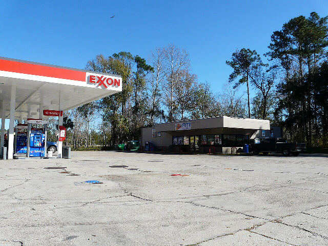 An Exxon gas station, a fuel brand of Exxon Mobil, with the red Exxon sign on its canopy near St. Marks, Florida